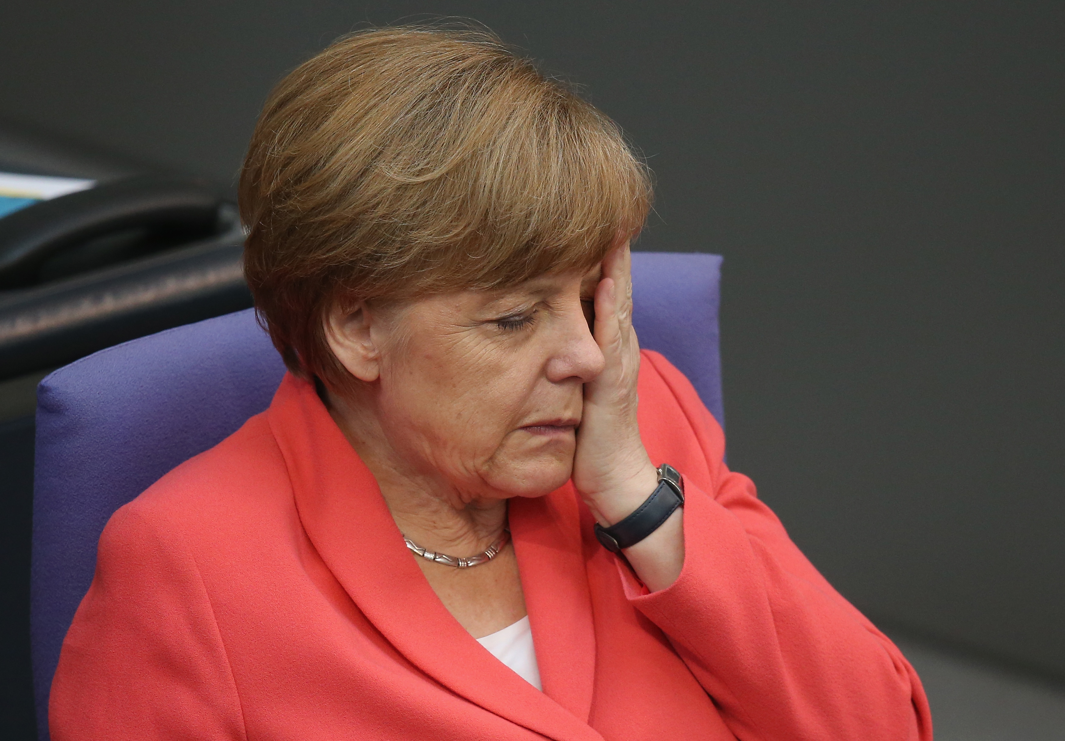 BERLIN, GERMANY - JULY 17: German Chancellor Angela Merkel attends debates prior to a vote over the third EU financial aid package to Greece at an extraordinary session of the German parliament, the Bundestag, on July 17, 2015 in Berlin, Germany. The Bundestag is among several European parliaments that must vote on whether to allow negotations over the aid package that will help Greece to avert state bankruptcy and shore up the Greek banking system. (Photo by Sean Gallup/Getty Images)